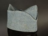 a hat with a cat ' s ears on top of a mannequin head