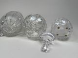 three clear glass vases sitting next to each other on a white surface