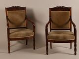 pair of antique chairs with upholstered upholstered back and arms