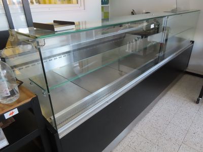a glass display case in the middle of a store