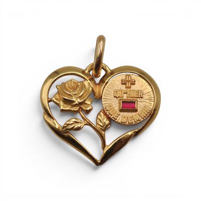 a close up of a heart shaped pendant with a rose on it