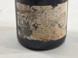 a bottle of wine that is sitting on a table