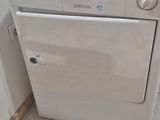 a white washer and dryer in a small room