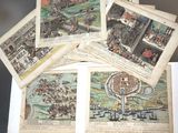 several old maps of a city are on display on a table