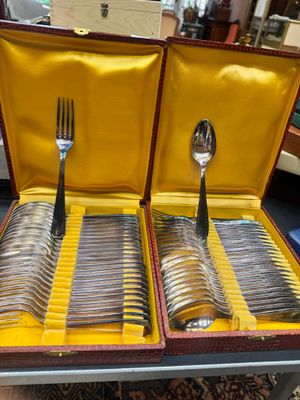 a case with silverware inside of it on a table