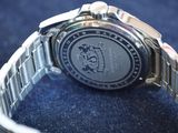 a close up of a wrist watch on a blue surface
