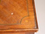 a wooden table with a clock on top of it