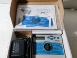 a box that has a camera and other items in it