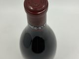 a bottle of wine that is sitting on a table