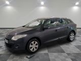 a picture of a grey car parked in a garage