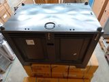 a large metal box sitting on top of a pile of boxes