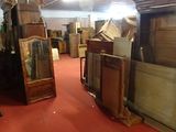 a room filled with lots of different types of furniture