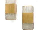 pair of wall sconces with gold and white marble panels