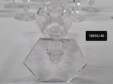 many crystal vases sitting on a white table