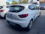 a white car parked in a parking lot with other cars
