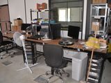 an image of a cluttered office with a lot of clutter on the desk