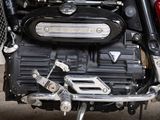 a close up of a motorcycle engine on a street