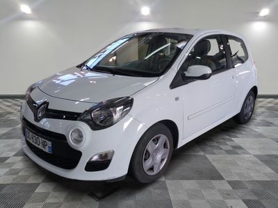 a picture of a small white car parked in a garage