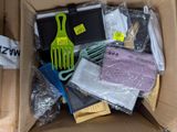 a box full of hair brushes and other items in it