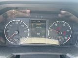 a close up of a car dashboard with a speedometer and gauges