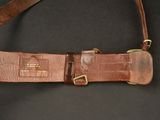 a close up of a leather belt with a buckle on it