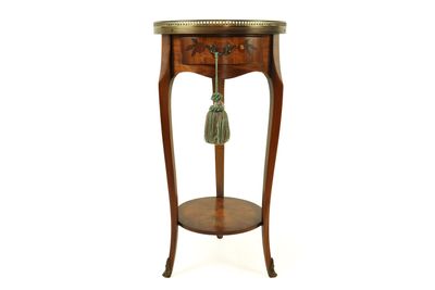 an image of a side table with a tassel on it