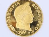 l'image d'une pièce d'or sur laquelle figure une tête de femme