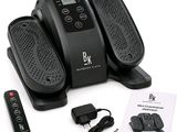 three foot massagers and a remote control on the table