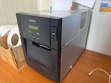 a black machine sitting on top of a wooden table