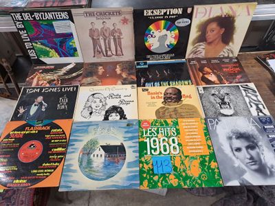 a lot of records on a table in a room