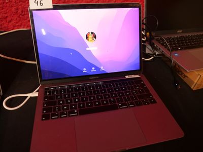 two laptops that are sitting on a table
