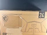 a box that is sitting on a table with a laptop in it