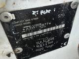 a close up of a metal plate with a chain around it