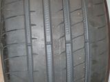 a close up of a tire on a white surface