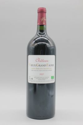 bouteille de vin rouge avec une étiquette du Château Merix Grand Faure