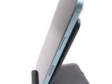 a cell phone that is sitting on top of a stand