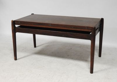 a wooden coffee table with a drawer underneath it