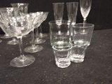 a lot of empty wine glasses sitting on a table