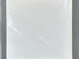 a close up of a white box on a gray surface
