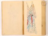 an open book with a drawing of an angel on it