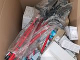 a cardboard box filled with electronic equipment and other items
