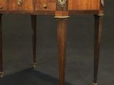 an antique writing table with two drawers and a drawer on the top
