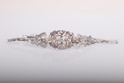a diamond and white gold broochle bracelet