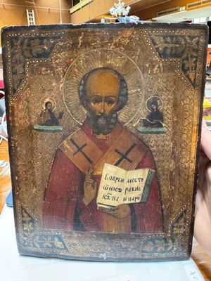 painting of a man holding a book in his hand