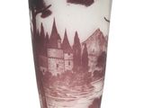 a vase that has a picture of a castle on it