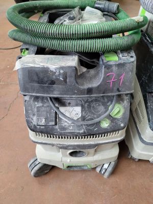 two vacuums sitting on top of each other on the floor