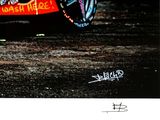 a picture of a red car with graffiti on it