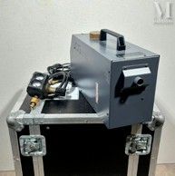a small metal box with a metal object in it