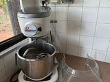 a kitchen with a mixer and a bowl on the counter