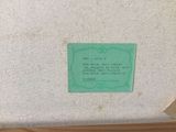 a green plaque on the wall of a room